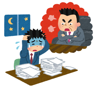 上司に怒られ残業している男性